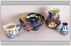 Four Pieces of Maling Lustre Ware comprising of a bowl, jug and two vases.