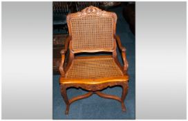 French Walnut Carved Frame Armchair with bergee back & seat with shaped back rail and arms. On