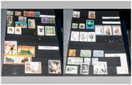 Four large sixteen page stamp stockbooks covering all ages with lots of modern mint. Nicely