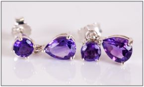 Pair of Amethyst Drop Earrings, each comprising a pear cut amethyst drop, suspended from a similar