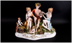 Large Capo Di Monte Figure Group Of A Bacchanalian Scene with attendant maidens with cherubs. In