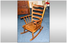 Oak Rocking Chair with solid seat on rockers.