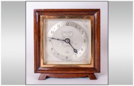 Elliott Oak Cased CLock, circa 1930's Features Silvered Dial, Bakelite Back, Chrome Furniture, S.F