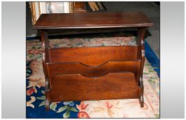 Mahogany Newspaper Stand with central apertures for magazines with shaped Lyre sides. 23'' in width,