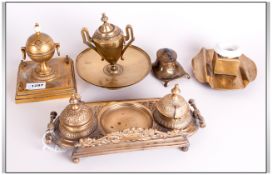 Five Brass Inkwells, double inkwell with cast floral back, single ink in the shape of an urn,