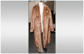 Ladies Light Brown Musquash Coat, fully lined.