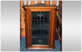 Edwardian Oak Leaded Single Glazed Door Corner Cupboard, of small proportions, with two interior