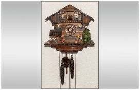 Black Forest Cuckoo Clock with weights and pendulum.