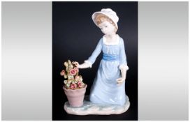 Lladro Figure ' Flower In a Pot ' Model Num.5028. Issued 1980-1985. Height 8.5 Inches. Stands 9