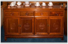 Modern Polished Sideboard with four drawers above cupboards.