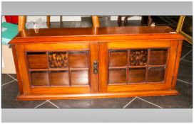 Walnut Glazed Double Door Bookcase with bubble glass astral glazed. 42'' in width by 10'' in depth.