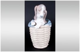 Lladro Animal Figure ' Dog In a Basket ' Model Num.1128. Issued 1971-1985. Height 7.5 Inches. Mint