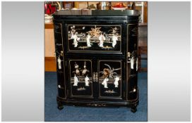 Black Lacquered Chinese Cocktail Cabinet onlaid with carved figures of Mother Of Pearl, depicting