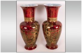 A Pair of Wilton Ware Lustre Rouge Red Vases decorated in gilt work depicting Japanese Geisha girls.