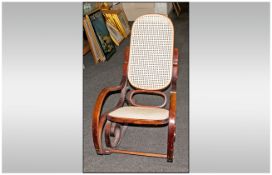Bentwood Rocking Chair with shaped arms and rockers and an oval shaped back. Fully burgee seat &
