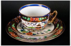 Noritake Trio comprising cup, saucer and side plate, gilded in the Imari style pattern.