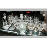 An Assorted Collection Of Glassware comprising a set of 12 cut glass low bowl champagne glasses, a