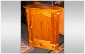 Free Standing Pine Corner Cupboard with Two Shaped Interior Shelves on a Plinth Base and Moulded