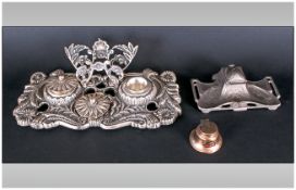 Three Silvered Metal Inkwells, one in the art nouveau style, another in the French style with letter