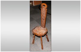 Carved Oak Milking Type Chair on four turned legs, with a carved seat & carved tapering splat