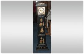 Chinese Black Lacquered Grandmother Long Case Clock with a square brass dial. Decorated in