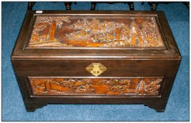 Chinese Camphor Wood Carved Bedding Box with a carved panel to the top. Carved with Chinese