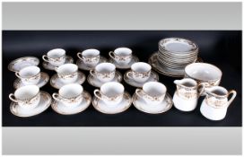 Noritake Part Dinner Service Comprising 2 sandwich/fruit plates, milk jug, side plates, cups,