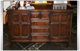 Traditional Stained Oak Dresser Base with 2 side cupboards and central chest unit.