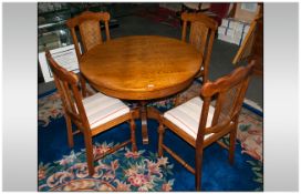 Reproduction Oak Continental Dining Set consisting of a large pedestal base table, with a bergere