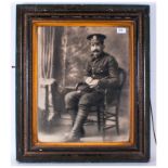 Large Photograph Of A First World War Soldier, seated in a studio setting, Circa 1914/18. Framed &