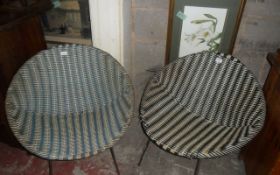 Set of Two Wicker Chairs with Metal Legs.