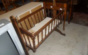 Old Fashioned Wooden Crib on Stand. Is Able to Rock.