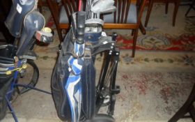 Set of Golf Clubs In Bag with Umbrella and Trolley with Wheels.