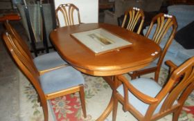 Wooden Table with 6 Wooden Matching Chairs.