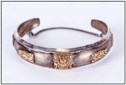 South American Silver & 18ct Gold Bangle, the silver overlaid with 18ct Gold Aztec style decoration.