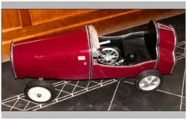 A Replica Childs Pedal Racing Car of the 1930's Style, painted in maroon red, open top. Similar to a
