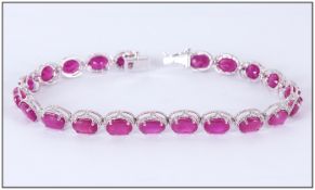 Ruby Oval Cut Tennis Bracelet, 25cts of rich red rubies, oval cut and set in narrow rhodium and
