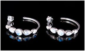 Rainbow Moonstone Hoop Earrings, each with a round cut moonstone to the centre front and two