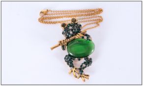 Green Crystal and Cat's Eye Pendant/Brooch, an amusing figure of a frog playing a flute, the head