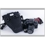 Canon EoS 700D Camera with attached Canon Zoom Lens., E.F 35-80mm. Complete with Canon shoulder