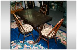 Ercol Dining Table & Four Chairs In A Dark Oak Finish, 4 hoop back Windsor type chair with loose tie