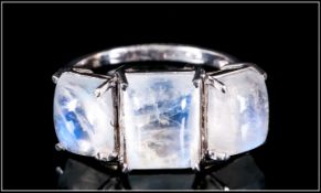 Rainbow Moonstone Trilogy Ring, the centre baguette cut cabochon of 4cts flanked by two further,