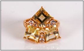 Green Gold Quartz and White Topaz Ring, in trillion style, comprising three square cut green gold