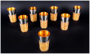 Stuart Devlin Fine Set Of Eight Silver & Silver Banded Beakers, each beaker with polished tapering