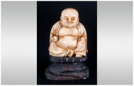 Chinese Late 19th Century Ivory Buddha Figure, Raised on a Black Lacquered Base. Stands 2.5 Inches