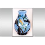 Moorcroft Fine and Modern Trial Vase, Decorated with Images of Pale Blue on Dark Blue Flowers.