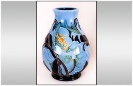Moorcroft Fine and Modern Trial Vase, Decorated with Images of Pale Blue on Dark Blue Flowers.