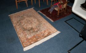 Two Oriental Carpets, one of Bokara type on a ruby red ground. 36x60'' geometric design carpet in