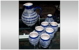 Collection of German Pottery comprising large jug, small jug and six tankards.