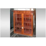 Early Victorian Mahogany Astral Glazed Double Door Cabinet with three shelves to the interior with a